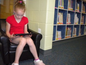 girl reading ipad